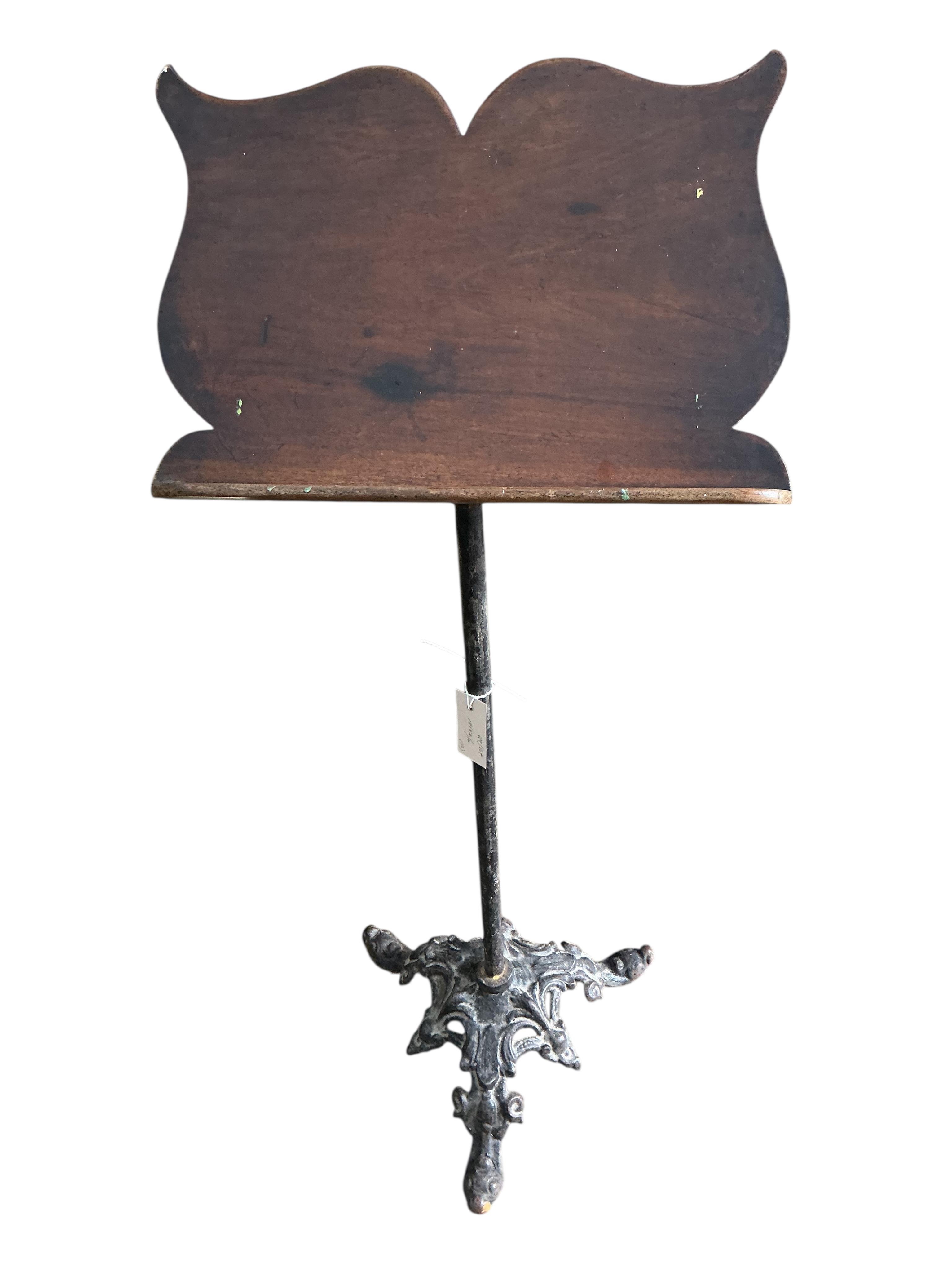 A pair of Victorian and later cast iron pine and mahogany music stands, height 112cm